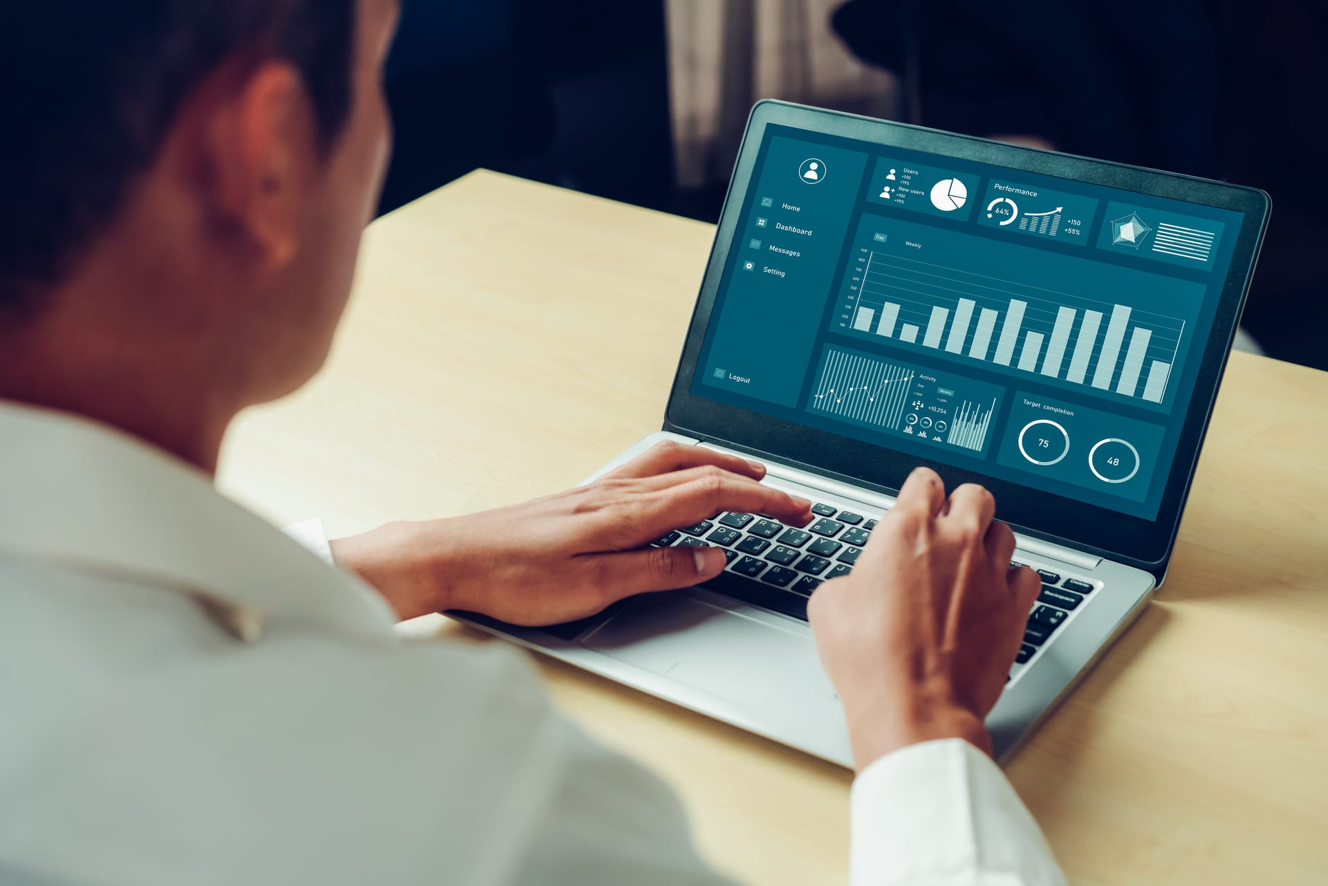 Analyst reviewing a business dashboard on a laptop