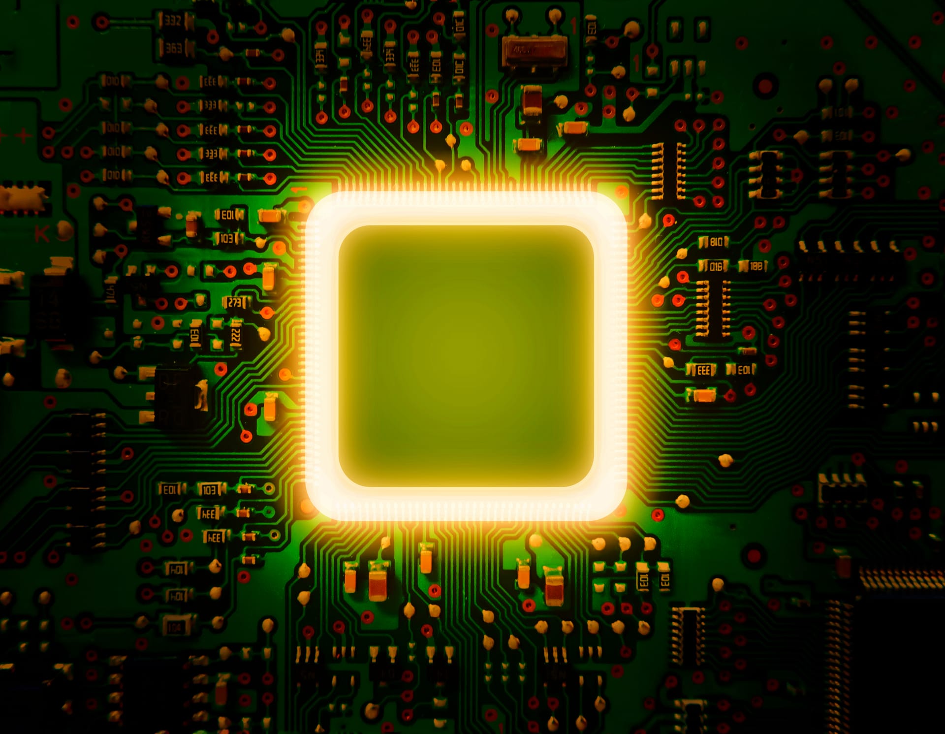 Processor chip glowing amber on a circuit board
