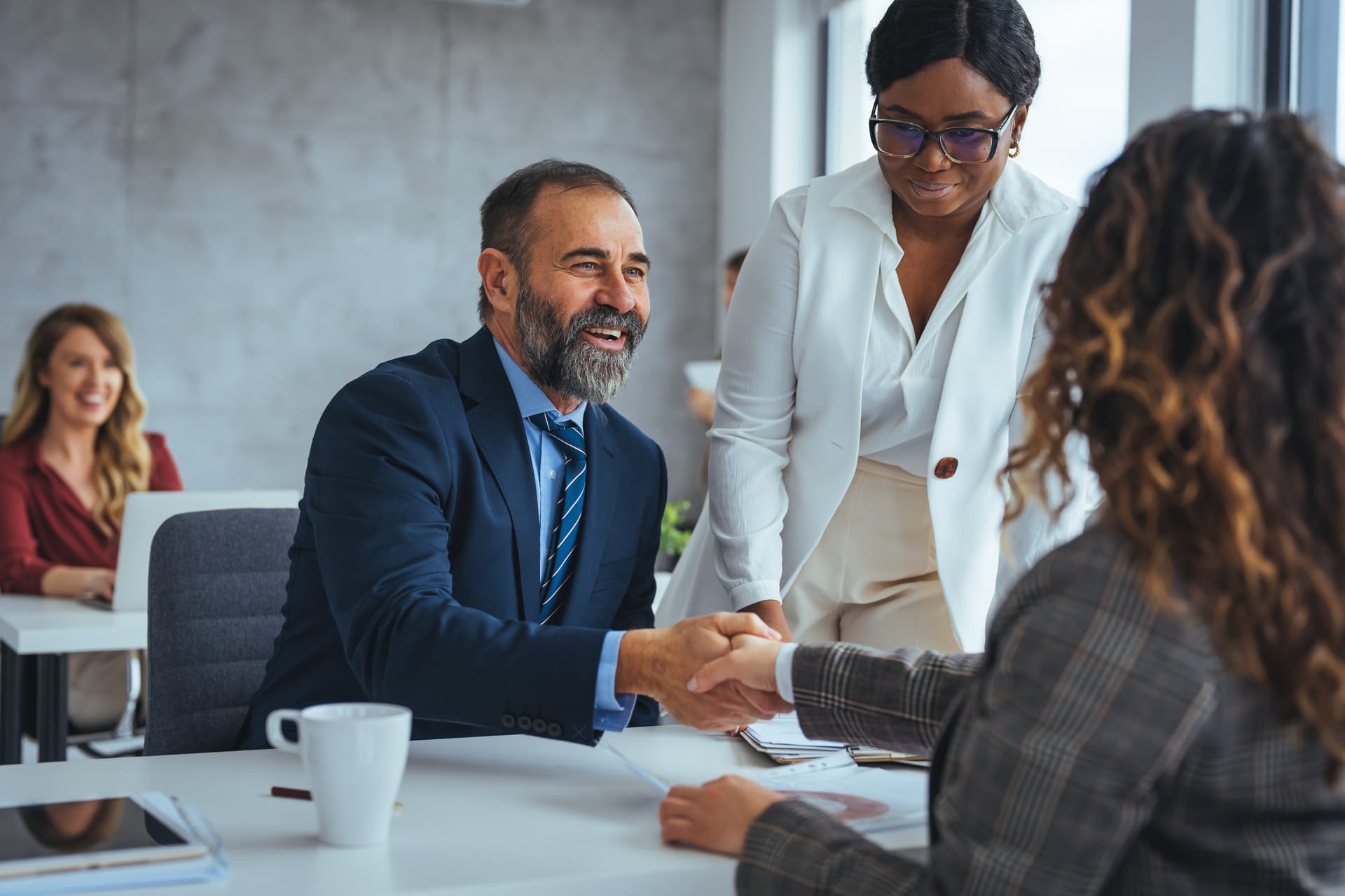 Colleagues shaking hands after a successful interview