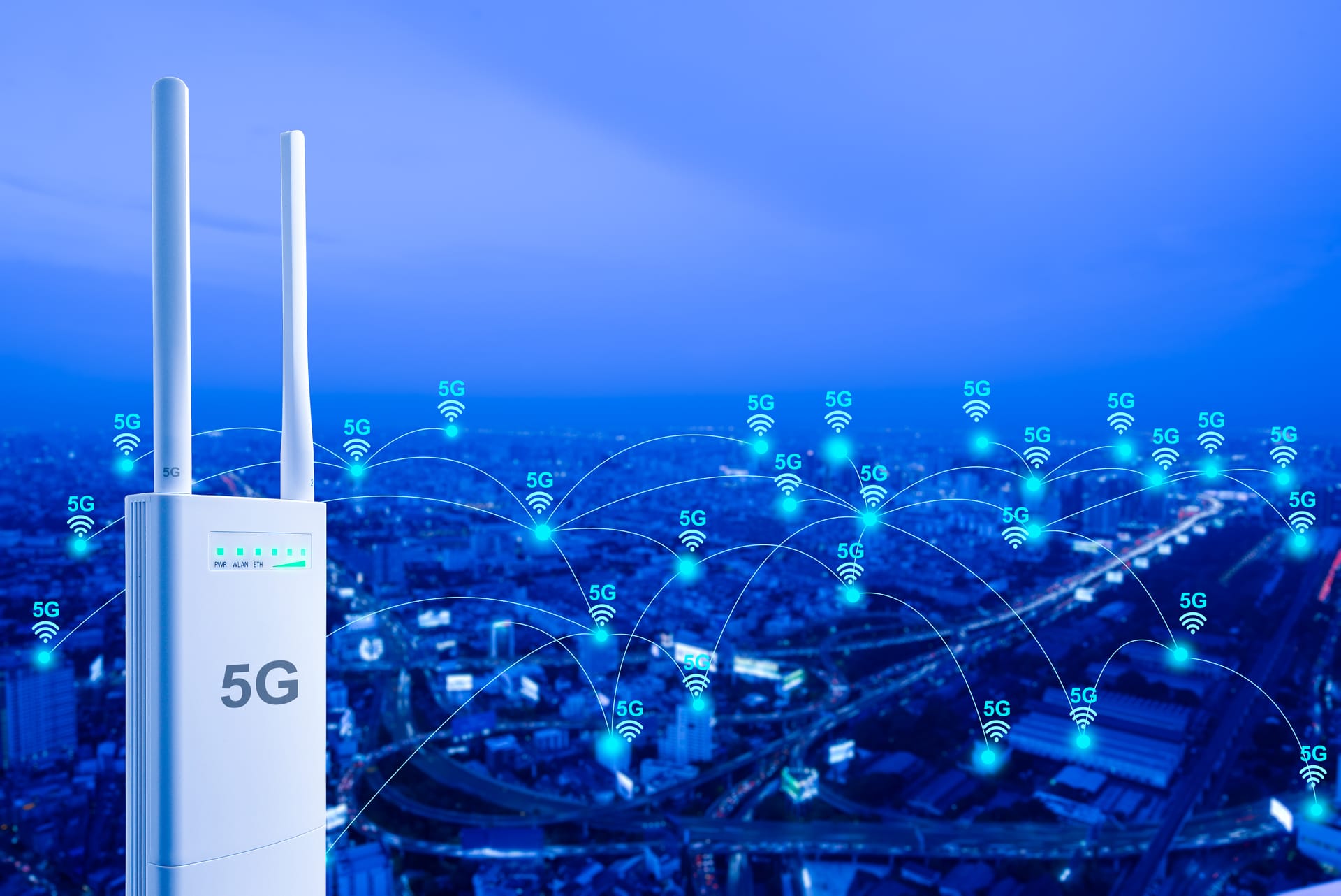 Wireless network links glowing over a city at night
