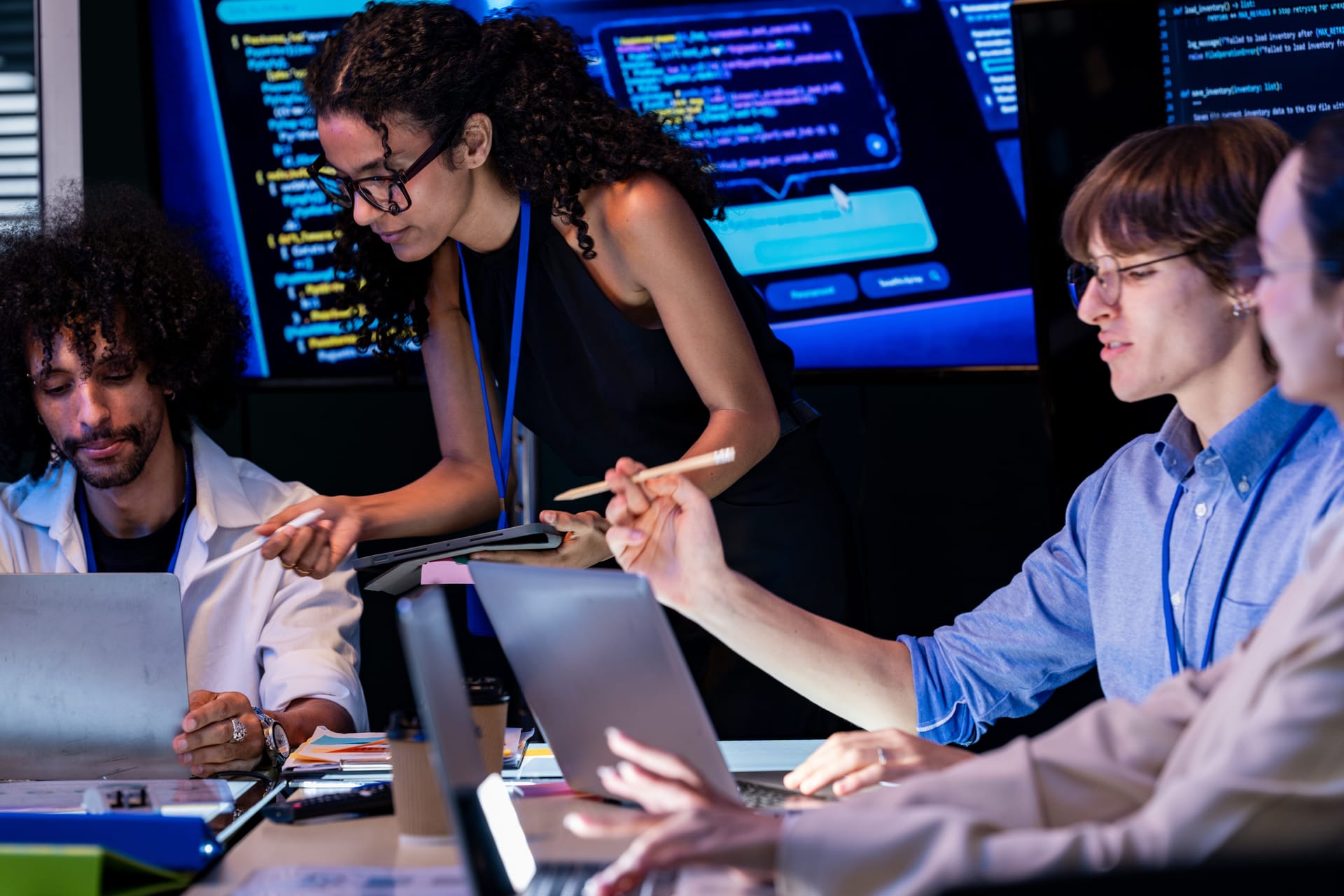 Engineers tracking a running test on a wall of monitors